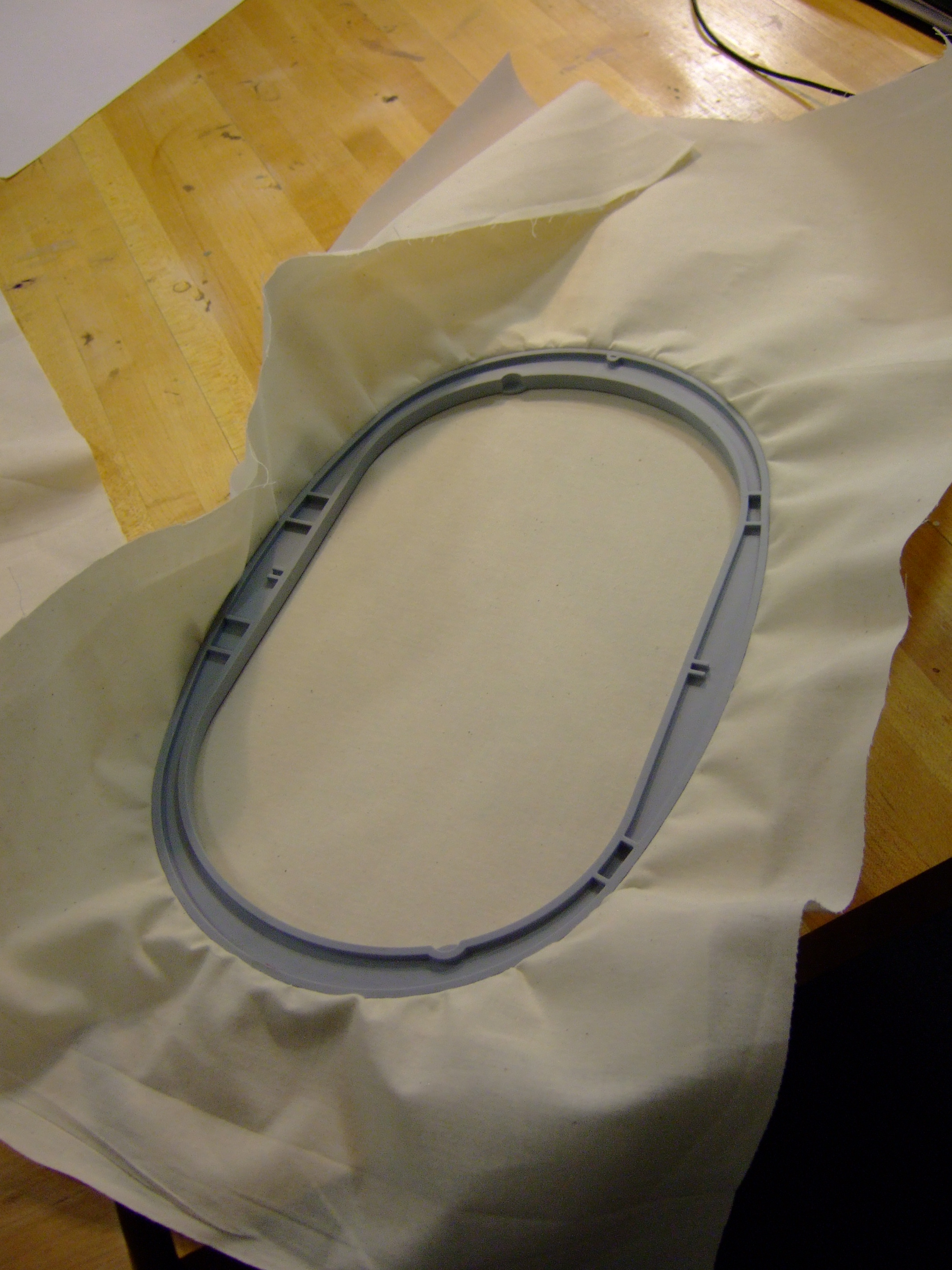 Putting the fabric into the embroidery hoop